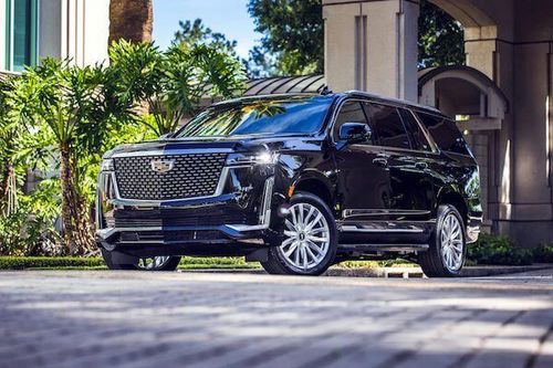 Luxury black SUV in upscale urban setting
